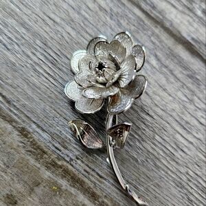 Signed Monet Vintage plated silver flower.